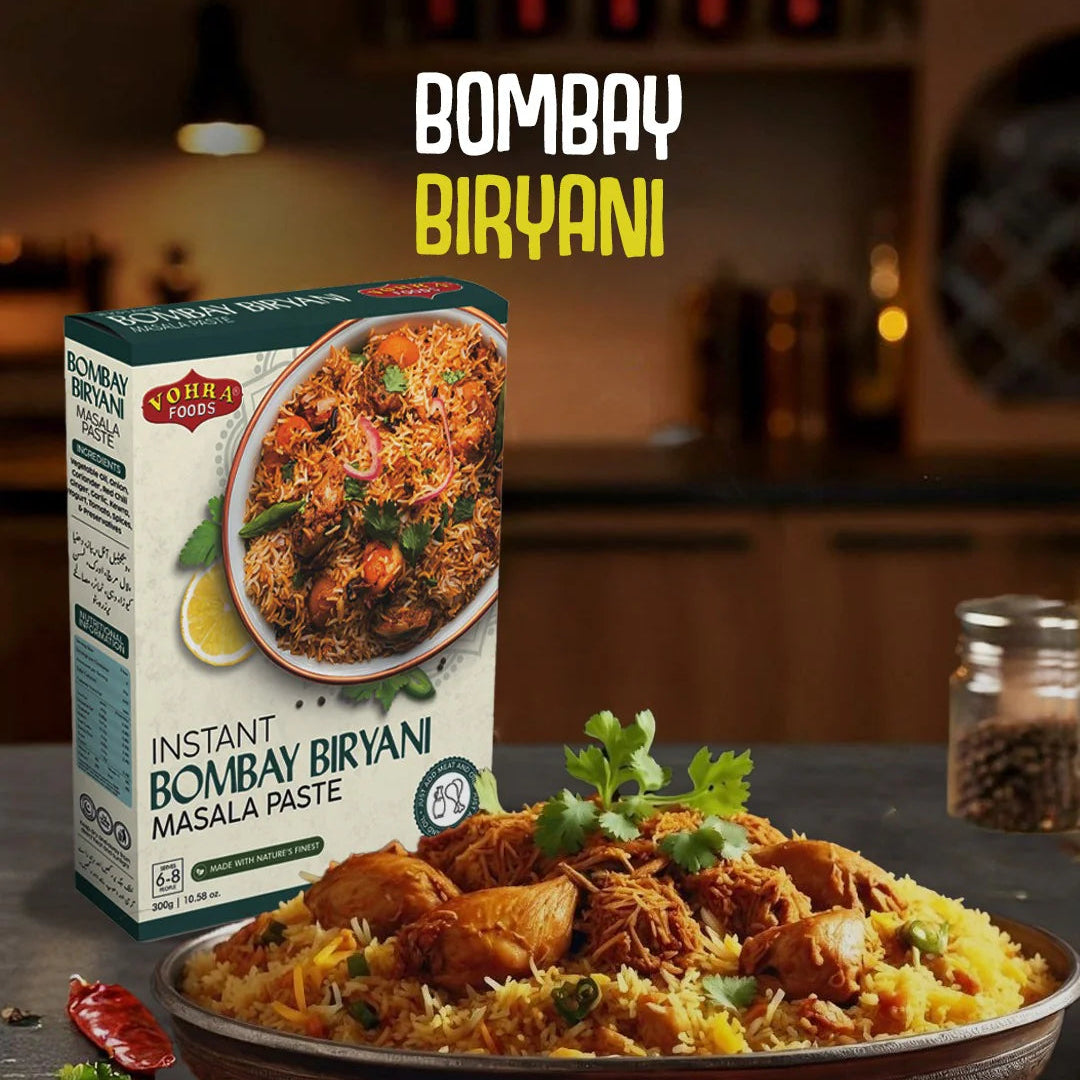Bowl of Bombay Biryani with a box of instant Bombay Biryani masala paste on a dark surface.