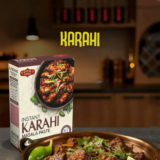 Karahi masala paste box with a bowl of karahi dish on a kitchen counter.