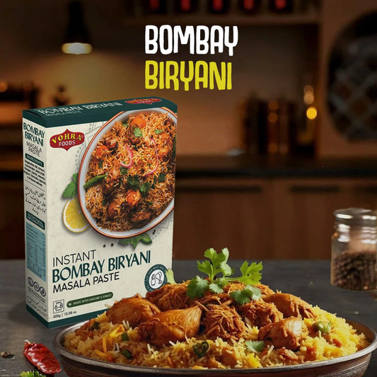 Bowl of Bombay Biryani with a box of instant Bombay Biryani masala paste on a dark surface.
